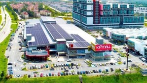 A commercial building with a KIPMALL sign, solar panels, and a parking lot. - The Miere Suites @ KLIA Sepang (Sepang)