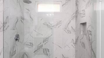 Shower, hair dryer, towels, shampoo