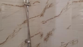 Basic Apartment | Bathroom | Free toiletries, hair dryer, towels, soap