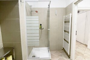 Shower, hair dryer, towels, soap