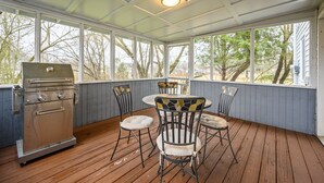 A covered outdoor area with a grill, chairs, and a table. - 10 Jill Lane, Cartersville (Cartersville)
