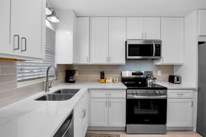 Fridge, dishwasher, coffee/tea maker, toaster