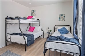 4 bedrooms, laptop workspace, iron/ironing board, bed sheets