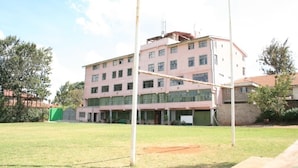 A multi-story building with a flat roof and large windows. - Sadili Oval B & B (Nairobi)