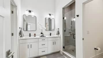 Shower, hair dryer, towels, toilet paper