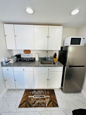 Fridge, microwave, stovetop, coffee/tea maker