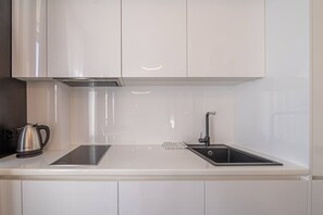 Fridge, microwave, stovetop, cookware/dishes/utensils