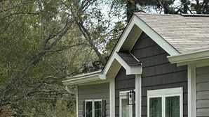 A small house with a wooden deck and a single staircase leading to the front door. - Mountain Retreat Near Waterfalls & Hiking Trails – Your Clarkesville Getaway (Clarkesville)