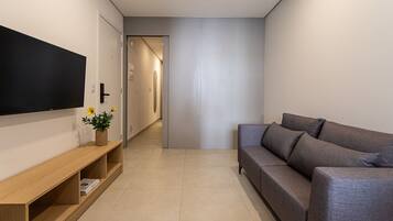 Apartamento exclusivo | Área de estar | Smart TV 40 polegadas com canais digitais