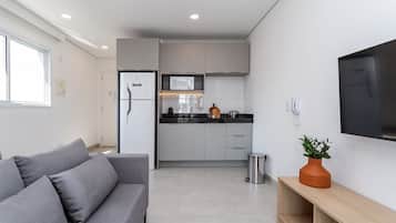 Apartamento design | Área de estar | Smart TV 40 polegadas com canais digitais