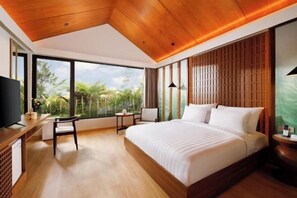 A modern hotel room with a large bed, wooden ceiling, and a view of greenery outside. - Dusun Bedugul Asri (Bali)