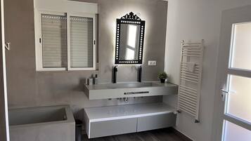 Shower, hair dryer, towels, toilet paper