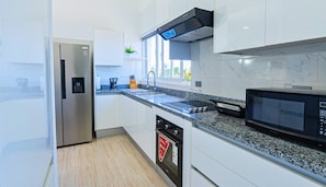 Apartamento, sacada, vista para o jardim | Cozinha privada