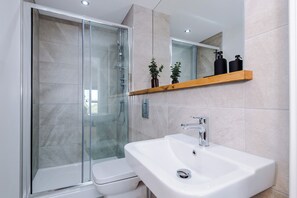 Shower, hair dryer, towels, soap