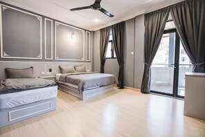 A bedroom with a bed, bedside tables, a ceiling fan, and a window with curtains. - Barrington Villa @ Golden Hill (Brinchang)