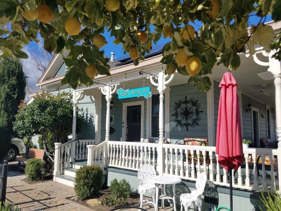 A house with a porch, white railing, and a sign that reads "JACK'S HOUSE".