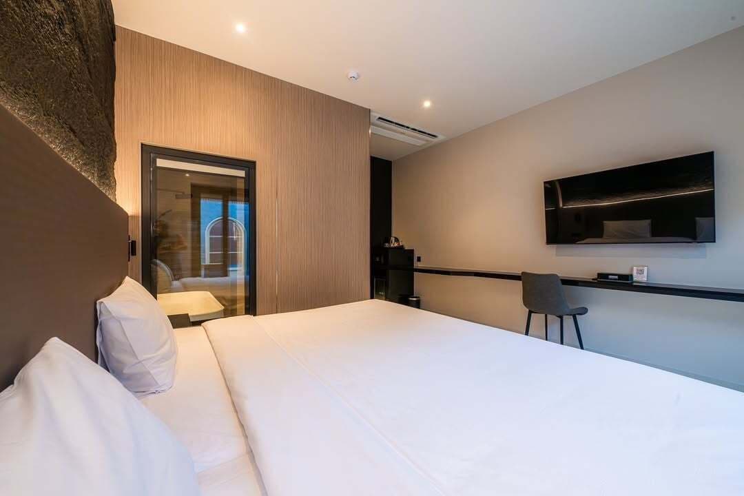 Deluxe Room, Balcony, Pool View | In-room safe, desk, blackout drapes, free WiFi