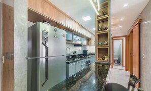 Basic Apartment | Private kitchen - Apartments in a Condo With a Pool and Gym - AGA (Camaçari)