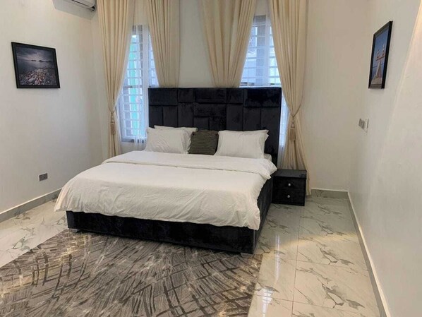 Economy Apartment, Balcony, City View | Desk, laptop workspace, blackout curtains, soundproofing