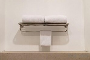 A wall-mounted toilet paper dispenser with two rolls of toilet paper. - Cordia Hotel Yogyakarta - Airport Hotel (Temon)
