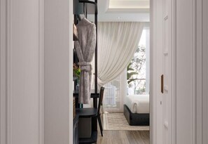 A hallway leading to a room with a bed, a chair, and a table. - Soho Premium Suites - Ben Thanh Market Area & SG's Heart (Ho Chi Minh City)