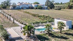 A large house with a swimming pool, surrounded by a landscaped garden and a hilly landscape. - DOMAIN PRIVATIZATION (Béziers)