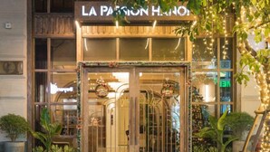 A hotel entrance with a sign reading "LA PASSION HOTEL". - La Passion Hanoi Hotel & Spa (Hanoi)