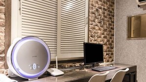 A modern desk with a computer, a smart speaker, and a monitor. - Jamsil Louize (Seoul)