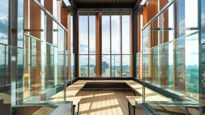 A high-rise building with large windows offering a city view. - Harmony Luxury Suites At Lucentia Bukit Bintang City Center (Kuala Lumpur)