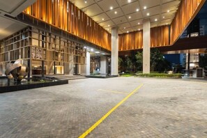 A spacious indoor area with a tiled floor and a yellow line marking. - Harmony Luxury Suites At Lucentia Bukit Bintang City Center (Kuala Lumpur)