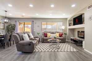 Luxury House, 4 Bedrooms, Private Pool, Pool View | Living area | 55-inch Smart TV with cable channels, Netflix, Hulu - Casa Aria 4BR Home & Heated Pool (Casa Grande)