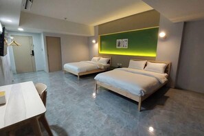 A hotel room with two beds, a desk, and a chair. - Chill Chill Hotel (Krabi)