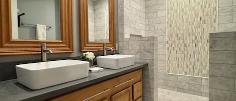 Shower, hair dryer, towels, toilet paper