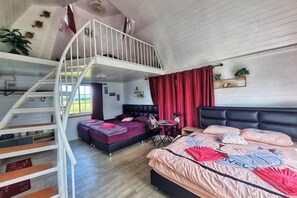 A bedroom with a bunk bed, a desk, and a staircase. - khao Thung Benja HomeStay (Phayuha Khiri)