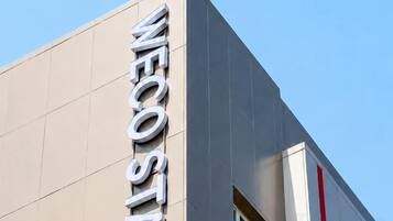 A building with 'WE COSTA' signage, indicating a location or establishment.