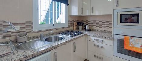 Fridge, stovetop, coffee/tea maker