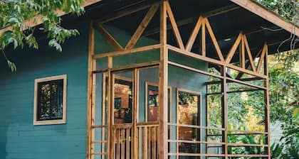 Surfside tiny home with modern amenities like AC, modern design, bathtub,and TV.