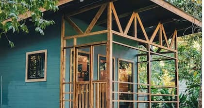 Surfside tiny home with modern amenities like AC, modern design, bathtub,and TV.