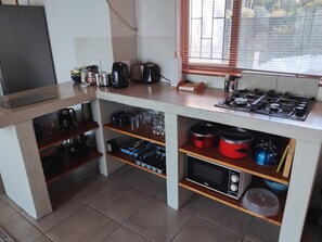 Fridge, microwave, stovetop, coffee/tea maker