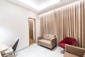 Luxury Suite, City View | Desk, laptop workspace, iron/ironing board, free WiFi