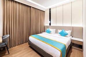 Luxury Suite, City View | Desk, laptop workspace, iron/ironing board, free WiFi