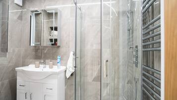 Shower, hair dryer, towels, soap