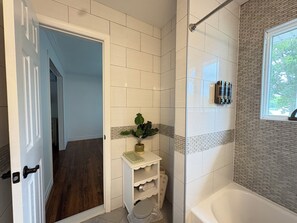 Shower, towels, soap, toilet paper