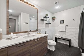 Shower, hair dryer, towels, shampoo