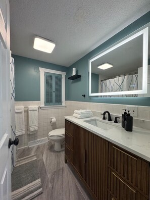 Shower, hair dryer, towels, soap