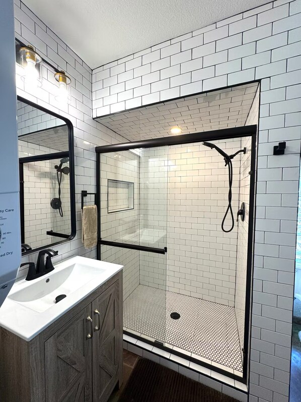 Shower, hair dryer, towels, soap
