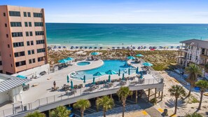 A resort with a large pool, beach access, and a view of the ocean. - 🌅 Chasing Sunsets | Harbor + Gulf Views | FREE Parasailing ☀️ (Destin)