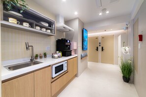 Mini-fridge, microwave, cookware/dishes/utensils