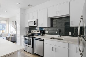 Fridge, stovetop, cookware/dishes/utensils