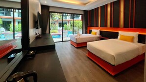 A modern hotel room with two beds, a TV, and a view of a swimming pool. - WOW PHUKET (Chalong)